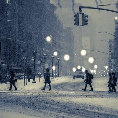 people walking on road covered with snow